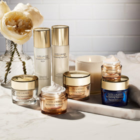 Estée Lauder applying cream to neck and cheek for visible lift and SPF protection