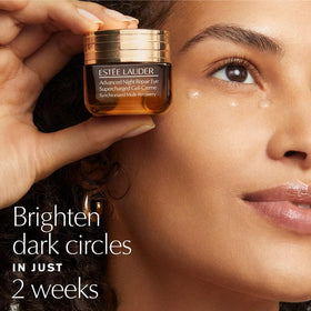 Estée Lauder set in use with model applying mascara and liner for bold eyes