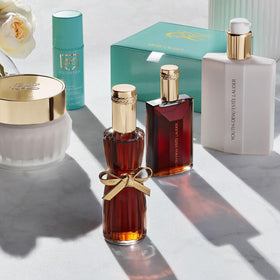Estée Lauder oil being poured into a bath illustrating relaxing aromatic soak