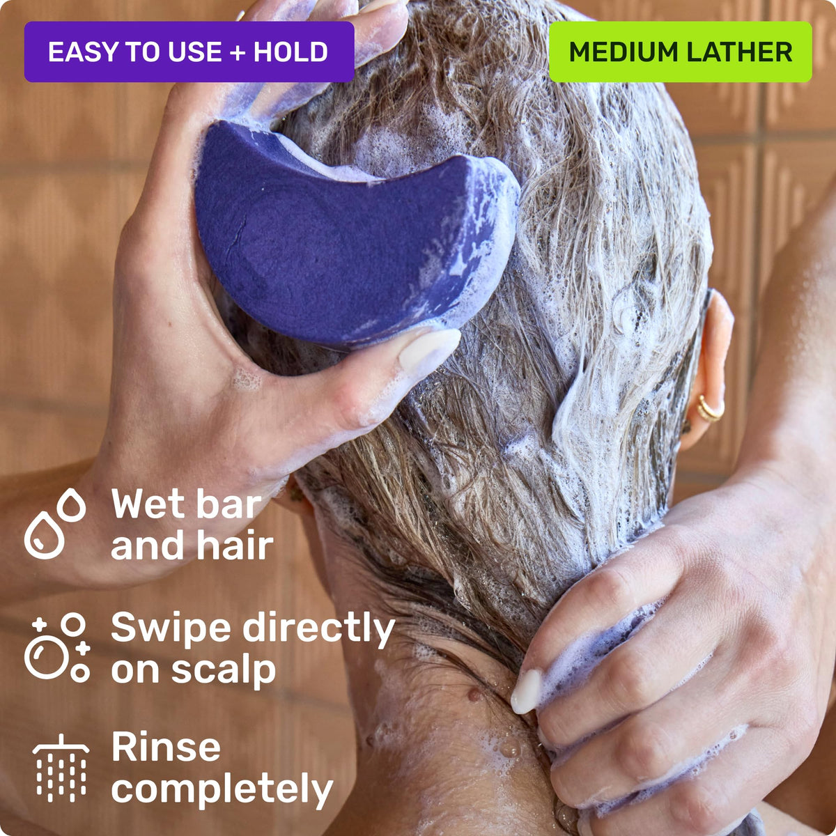 Ethique purple shampoo bar with ingredients spread showcasing natural botanicals