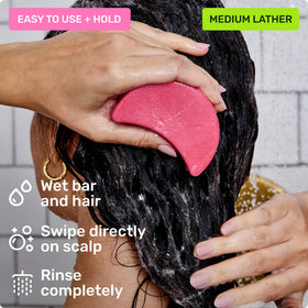 Stylist applying Ethique bar lather to color-treated hair to protect vibrancy and softness