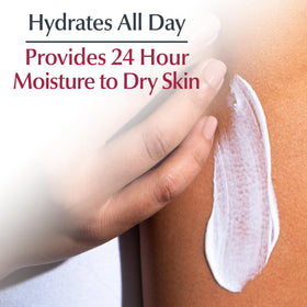 Applying Eucerin body cream from tube on arm for moisturized skin