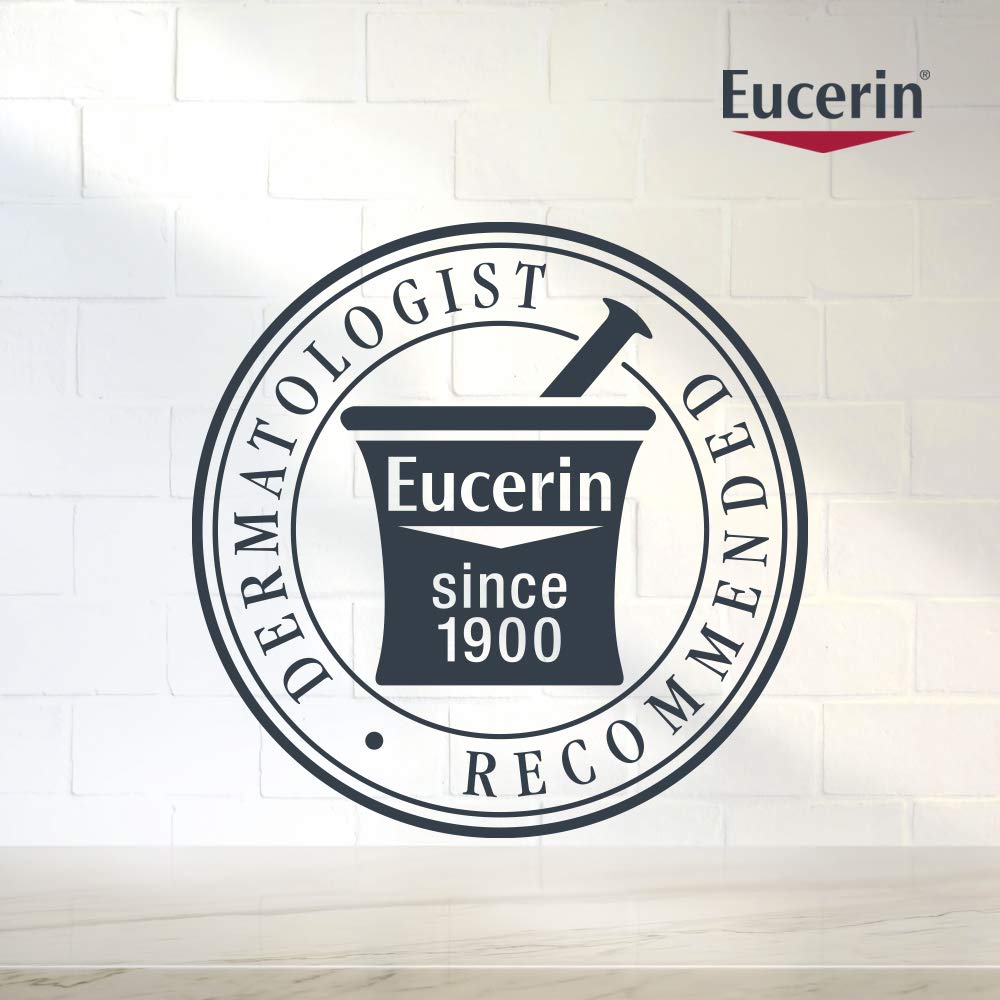Eucerin bottle in hand showing 13.5 fl oz size for reference