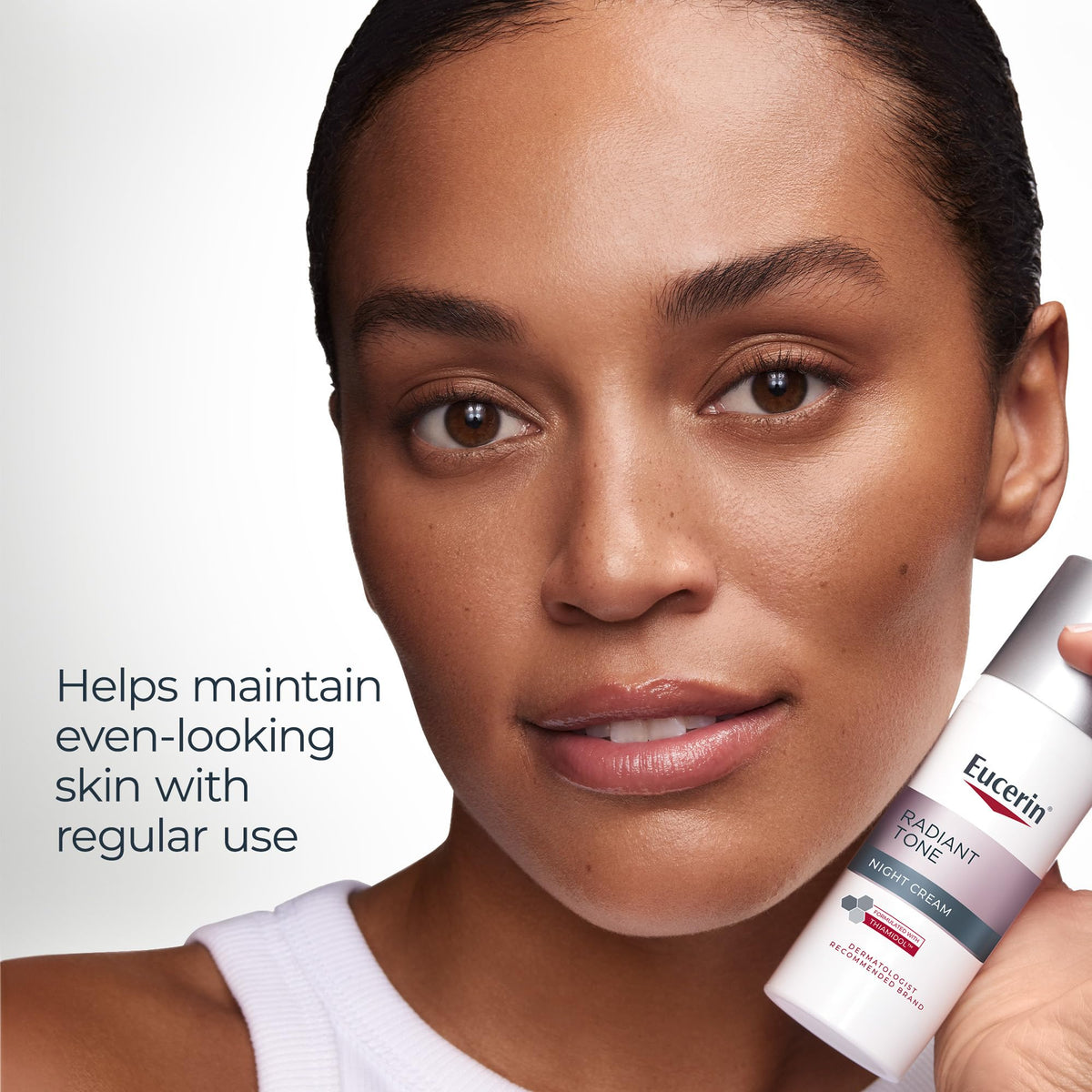 Eucerin bottle in hand to show 1.7 oz scale and travel-friendly benefit