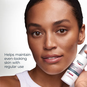 Eucerin bottle in hand to show 1.7 oz scale and travel-friendly benefit