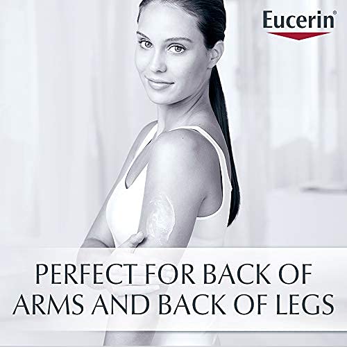 Eucerin 16.9 fl oz bottle beside hand to show actual size