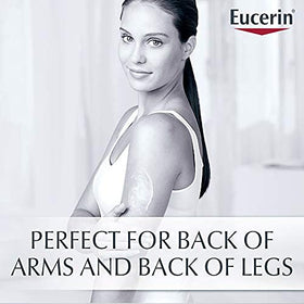 Eucerin 16.9 fl oz bottle beside hand to show actual size