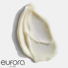 Eufora conditioner being applied to damp hair demonstrating detangling benefit