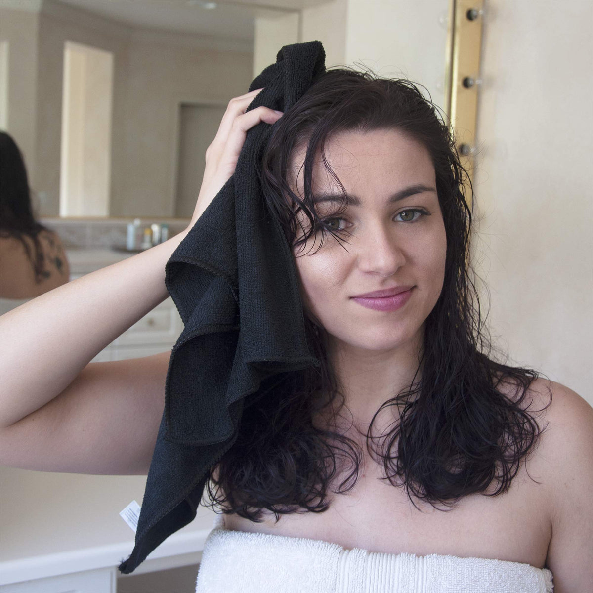 Eurow towel wrapped on client by stylist showing gentle drying benefit