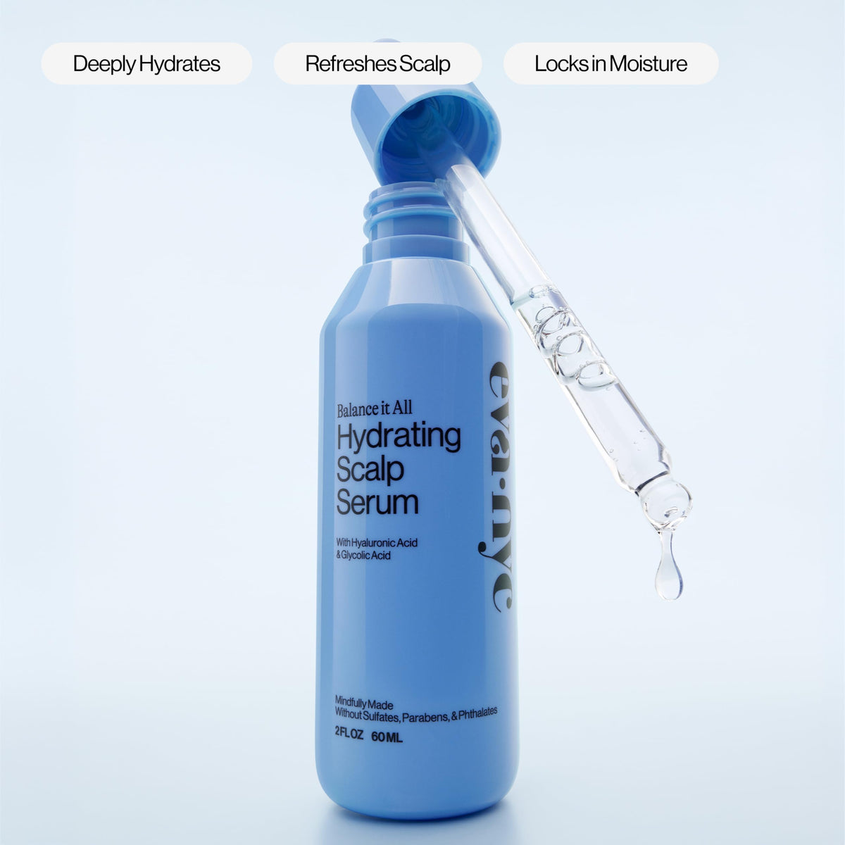 EVA·NYC applying serum to damp scalp to reduce dryness and soothe