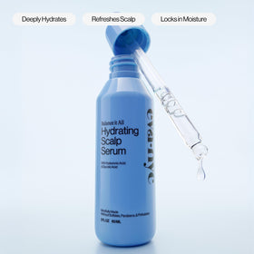 EVA·NYC applying serum to damp scalp to reduce dryness and soothe