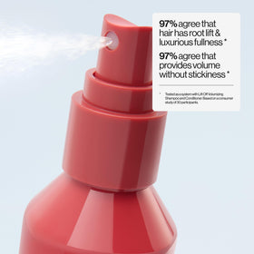EVA·NYC mist dispersing on hair strand to add texture and thickness