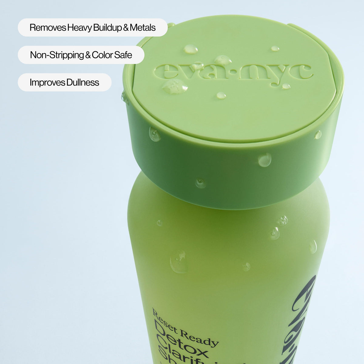 EVA·NYC 10 fl oz bottle next to a ruler for scale to show portable weekly-use size