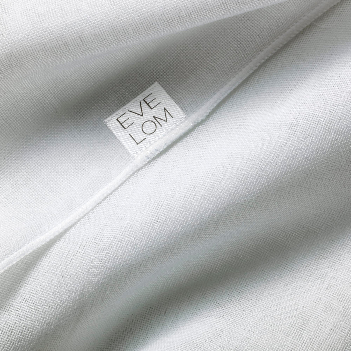 EVE LOM cloth removing cleanser from model's face demonstrating effective residue removal