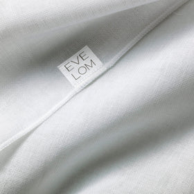 EVE LOM cloth removing cleanser from model's face demonstrating effective residue removal