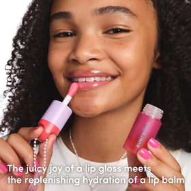Evereden lip gloss applied on a child model showing subtle color and hydrated lips