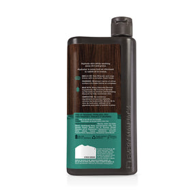 Every Man Jack bottle in gym bag emphasizing portable post-workout cleansing