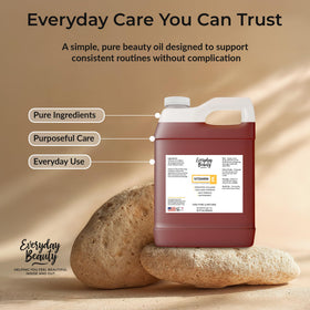 Everyday Beauty 32oz jug beside common bottle to show bulk size and long-lasting supply