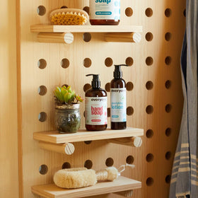 Everyone lotion bottle beside common objects to show 8 fl oz size