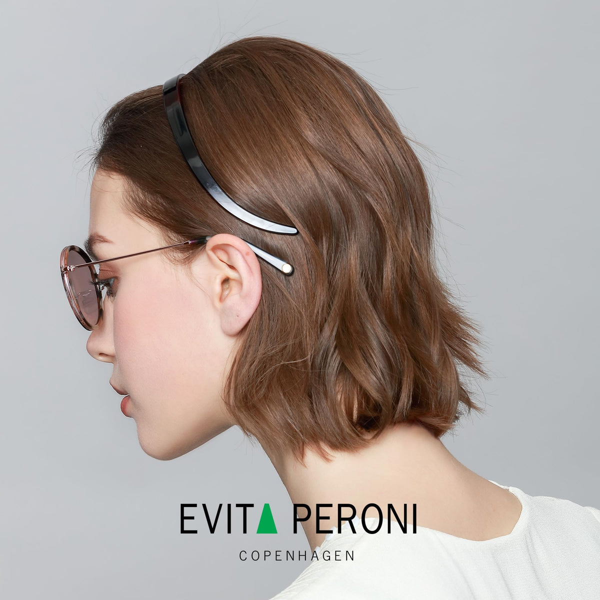 EVITA PERONI close-up of acetate texture revealing glossy finish and durable elasticity