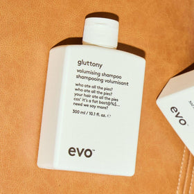 EVO on bathroom shelf in lifestyle setting conveying salon-quality results