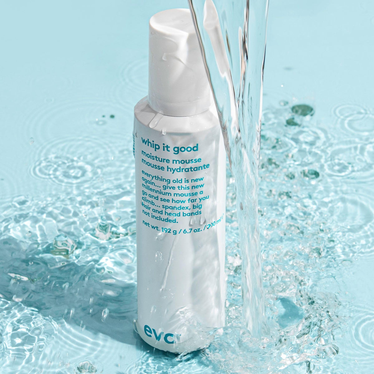 EVO Whip It Good next to a common shampoo bottle illustrating the 200ml size and travel-friendly scale