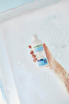 Exederm creamy texture closeup demonstrating moisturizing slip and softness
