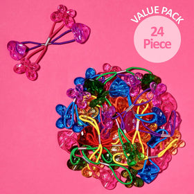 expressions hair ties next to ruler showing compact size and travel-friendly carry