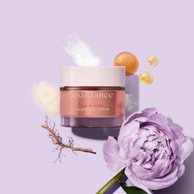 EXUVIANCE model applying cream to cheek demonstrating lifting and contour-enhancing effect