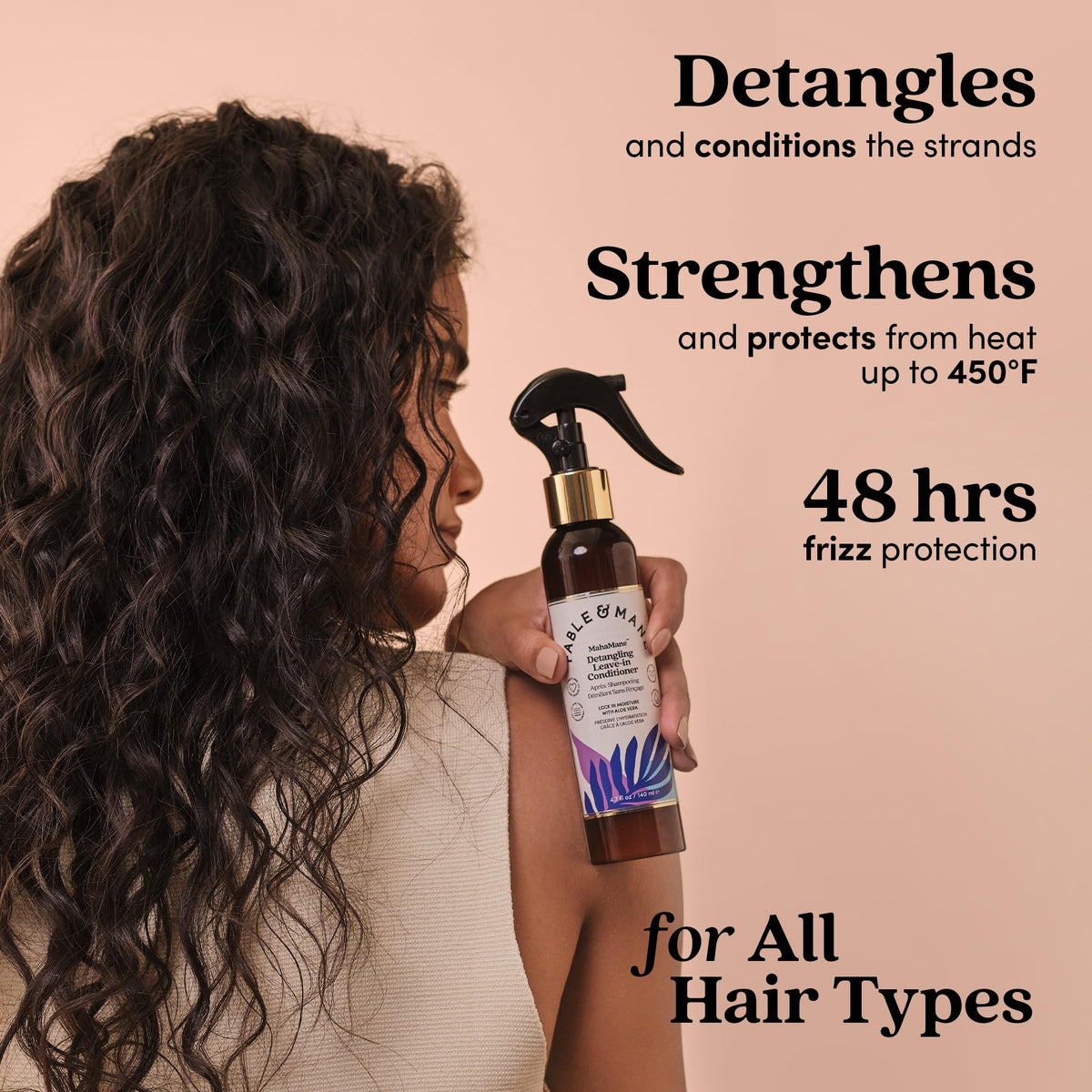 Fable & Mane being sprayed on damp hair for easier combing