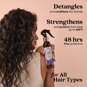 Fable & Mane being sprayed on damp hair for easier combing