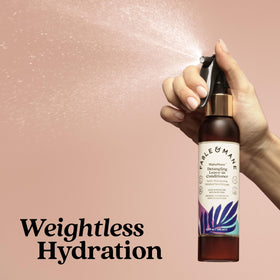 Fable & Mane bottle next to everyday items to show product size