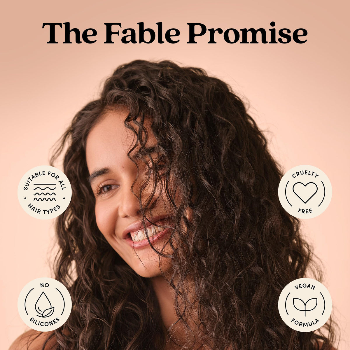 fable & mane bottle held for size comparison conveying travel-friendly volume