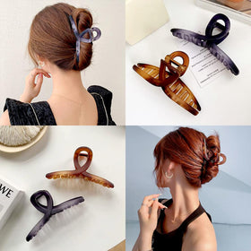FAELBATY clip securing a full updo, demonstrating strong hold and stylish look