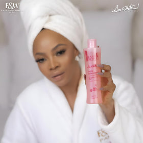 FAIR & WHITE lifestyle scene of body oil used during relaxing skincare routine