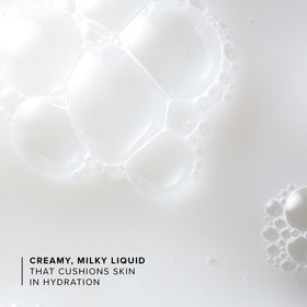 Essence soaked on cotton pad next to bottle, aids targeted hydration