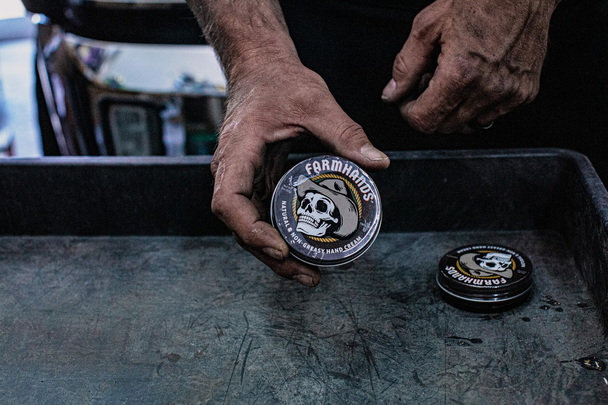 Farmhands tin next to gardening gloves showing hardworking hands benefit