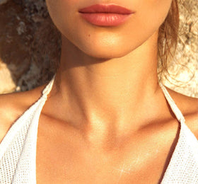 FarmHouse Fresh Lustre Drench applied on arm lifestyle shot showing instant sun-kissed radiance