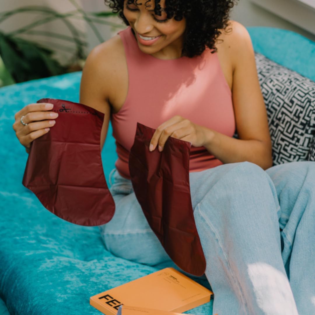 FEETS open box with four booties displaying full kit contents