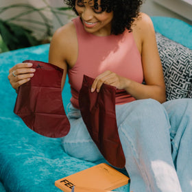 FEETS open box with four booties displaying full kit contents
