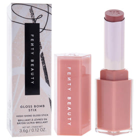 Fenty Beauty Fenty Glow held in hand demonstrating compact travel-friendly size