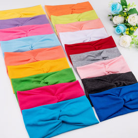 FEQO headband worn during yoga showing secure fit and workout comfort