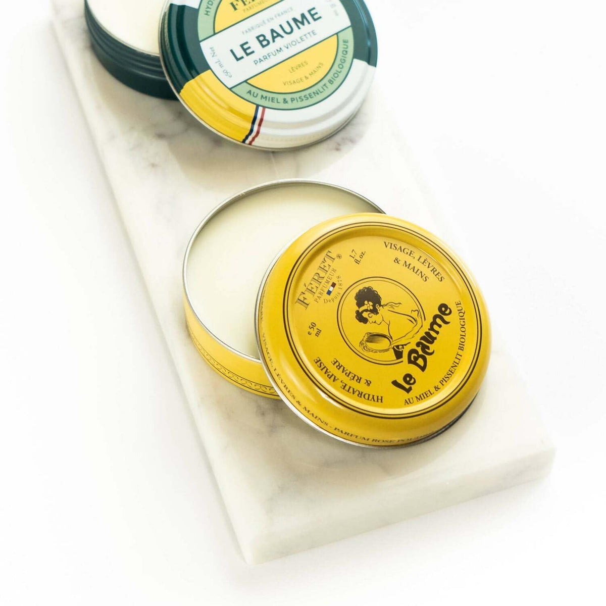Feret Parfumeur balm being applied to lips for instant smoothing comfort