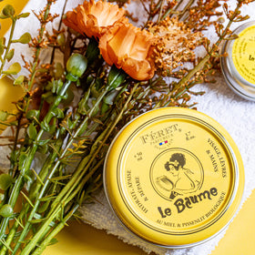 Feret Parfumeur ingredients flatlay showing natural oils and honey benefits