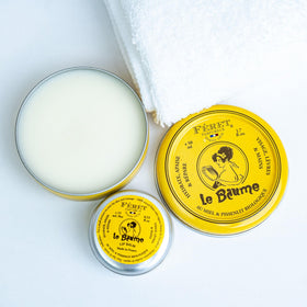 Feret Parfumeur balm styled with roses illustrating the powdery rose scent