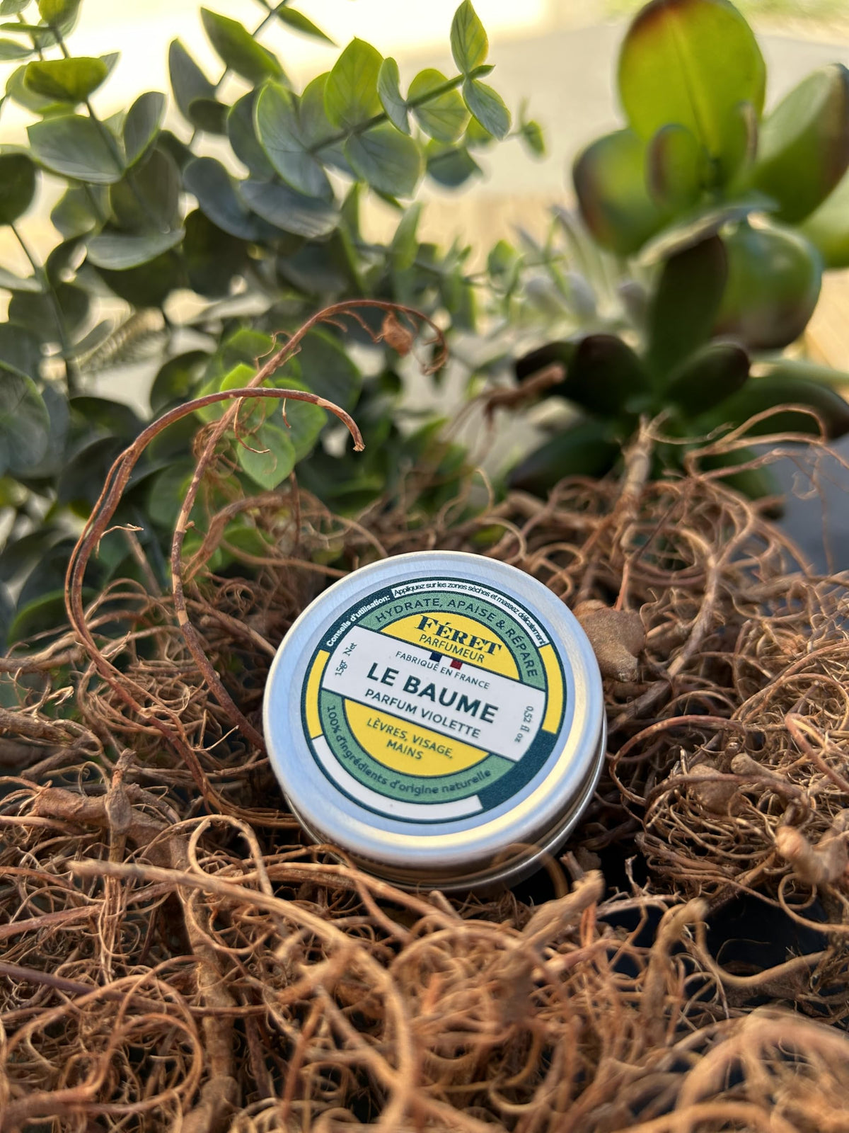 Feret Parfumeur tin next to coin for scale, travel‑friendly 15ml size