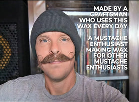 Fibonacci Mustache Wax tin in pocket illustrating portable grooming convenience
