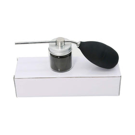 Finally Hair applicator in use applying fibers to part line for natural coverage