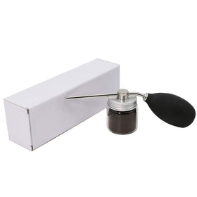 Finally Hair pump next to hand showing compact, travel-friendly size