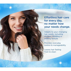FINESSE shampoo being massaged into wet hair for visible lift benefit